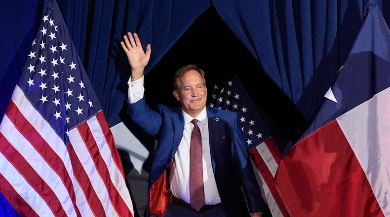 FILE - Texas Attorney General Ken Paxton, a Republican candidate for the U.S. Senate, waves as he takes the stage during a primary runoff election night event after winning the Republican party's nomination, May 26, 2026, in Plano, Texas. (AP Photo/Tony Gutierrez, File)