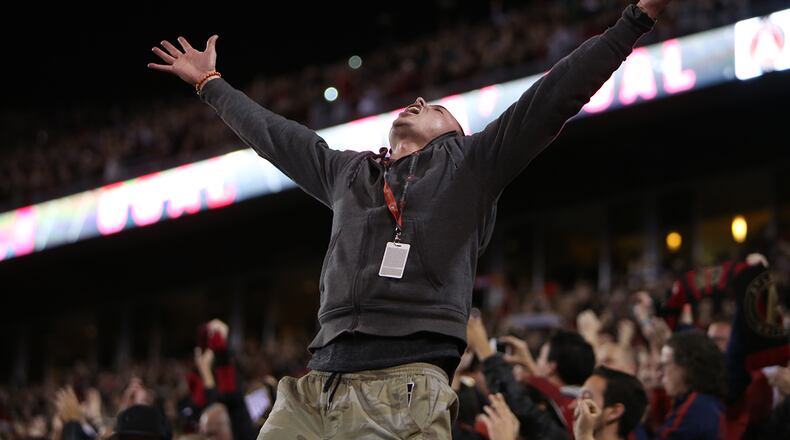 An Atlanta United fan jumps out of his seat after midfielder Yamil Asad scores the first goal in the franchise history. (Miguel Martinez / Mundo Hispanico)
