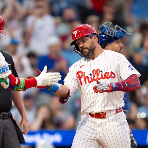 Philadelphia Phillies' Kyle Schwarber, front right, celebrates after his home run with Bryce Harper (3) during the third inning of a baseball game against the New York Mets, Saturday, June 20, 2026, in Philadelphia. (AP Photo/Chris Szagola)
