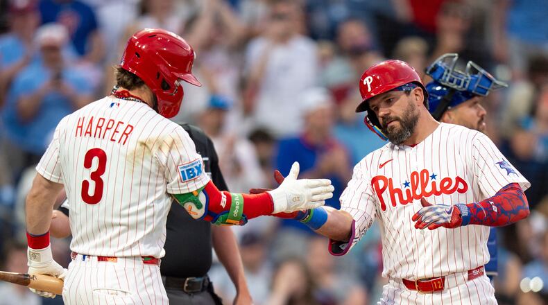 Philadelphia Phillies' Kyle Schwarber, front right, celebrates after his home run with Bryce Harper (3) during the third inning of a baseball game against the New York Mets, Saturday, June 20, 2026, in Philadelphia. (AP Photo/Chris Szagola)