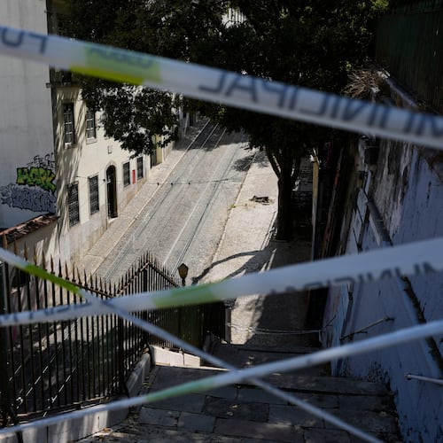FILE - Police tape cordons-off the access to the tracks of the Gloria funicular, a tourist streetcar that derailed and crashed, in Lisbon, Sept. 5, 2025. (AP Photo/Armando Franca, File)