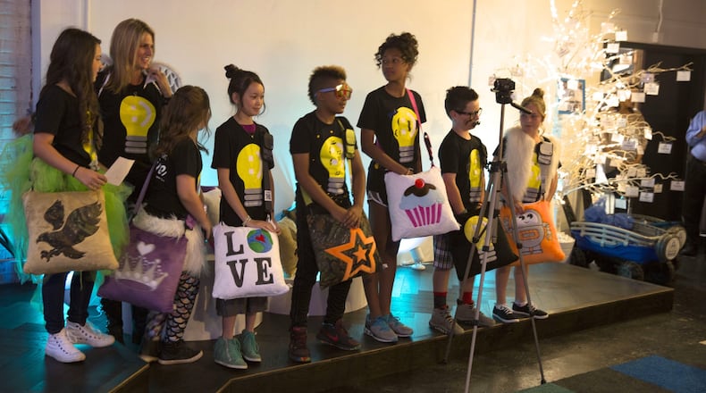 The nonprofit Children Helping Children organizes activities such as its Open Mic Program (pictured) and the Birthday Club Program to benefit young people in need.