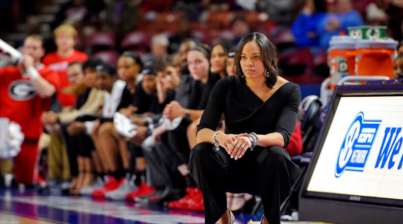 Georgia head coach Joni Taylor watches the action during the second half of a quarterfinal match against South Carolina at the Southeastern women's NCAA college basketball tournament in Greenville, S.C., Friday, March 6, 2020. (AP Photo/Richard Shiro)