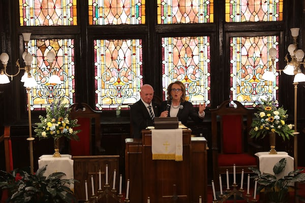 U.S. Sen. Mark Kelly, D-Arizona, left, and his wife Gaby Giffords, right, speak at a commemoration of the 10th anniversary of the Charleston Church Massacre at Mother Emanuel on Tuesday, June 17, 2025, in Charleston, S.C. (AP Photo/Jeffrey Collins)