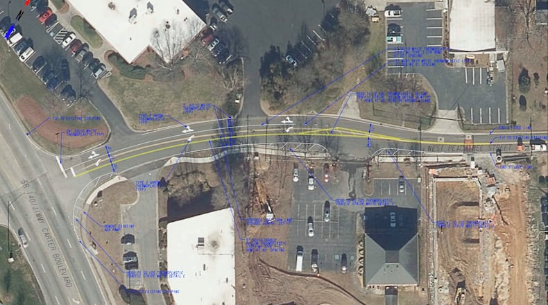 New striping and directional arrows clearly divide the roadway and help establish the beginning of a left turn lane from West Peachtree Street onto Jimmy Carter Boulevard in Norcross. (Courtesy Ccity of Norcross)