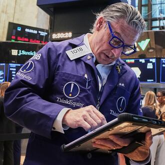 Trader John Romolo works on the floor of the New York Stock Exchange, Wednesday, June 3, 2026. (AP Photo/Richard Drew)