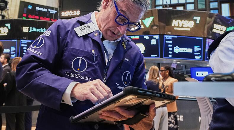 Trader John Romolo works on the floor of the New York Stock Exchange, Wednesday, June 3, 2026. (AP Photo/Richard Drew)
