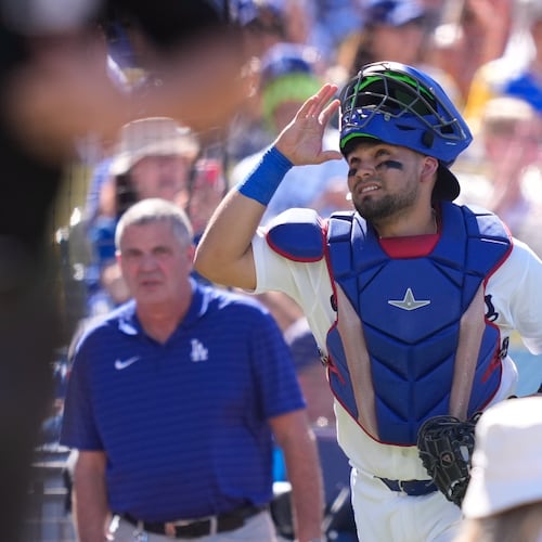 Los Angeles Dodgers catcher Eliezer Alfonzo looks toward the sky as he takes the field prior to a baseball game against the San Diego Padres, Sunday, July 5, 2026, in Los Angeles. (AP Photo/Mark J. Terrill)