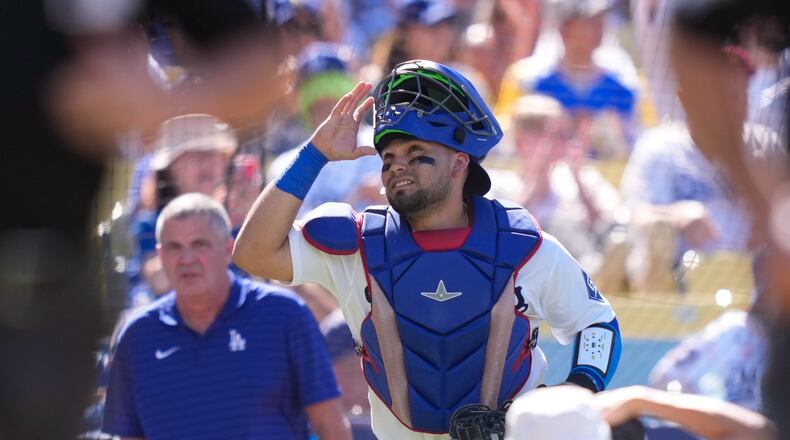 Los Angeles Dodgers catcher Eliezer Alfonzo looks toward the sky as he takes the field prior to a baseball game against the San Diego Padres, Sunday, July 5, 2026, in Los Angeles. (AP Photo/Mark J. Terrill)