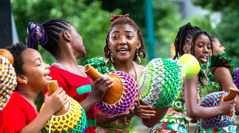 The performing arts collective Egun Omode performs at Centennial Olympic Park for the Juneteenth Atlanta Parade and Music Festival on Saturday, June 19, 2021. (Photo: Steve Schaefer for The Atlanta Journal-Constitution)