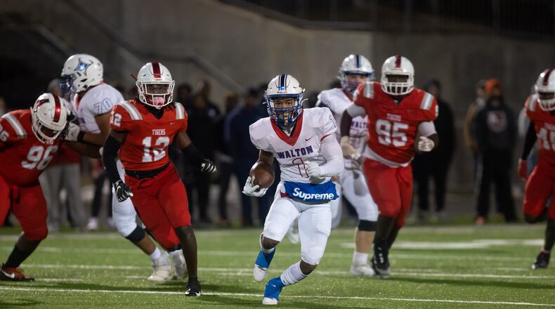 Walton's Sutton Smith (1) runs the ball during a GHSA high school football playoff game between the Archer Tigers and the Walton Raiders at Archer High School in Lawrenceville, GA., on Friday, November 19, 2021. (Photo/Jenn Finch)