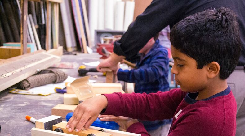 Rohan Dalvi, a fourth grader at The Galloway School in Buckhead, works on building a race car and track as part of the school’s “passion project,” a program that allots class time for students to work on projects that interest them.
