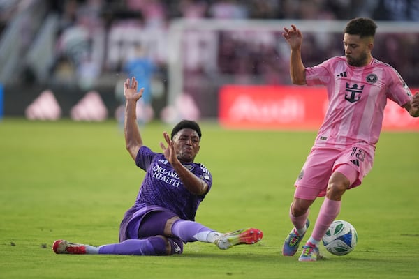Orlando City defender Alex Freeman, left, clears the ball to stop a scoring attempt by Inter Miami defender Jordi Alba (18) during the first half of an MLS soccer match, Sunday, May 18, 2025, in Fort Lauderdale, Fla. (AP Photo/Rebecca Blackwell)