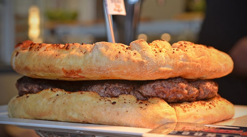 The Burgerizza, from Slice, will be one of the offerings for the 2017 Braves season at SunTrust Park. However, the Atlanta Braves will let fans bring in outside food, as long as it will fit in a clear, gallon-size container. CHRIS HUNT / SPECIAL