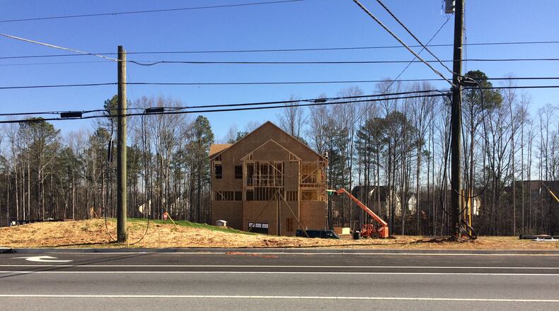 The bones of a model home sit in a future townhome development in Milton.