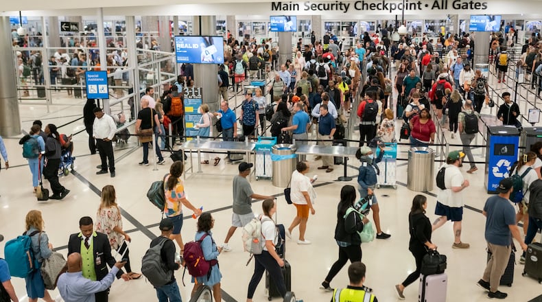 Traveler's wait in long lines Monday morning at Hartsfield-Jackson International Airport following July 4th weekend. Monday, July 8th, 2024 (Ben Hendren for the Atlanta Journal-Constitution)