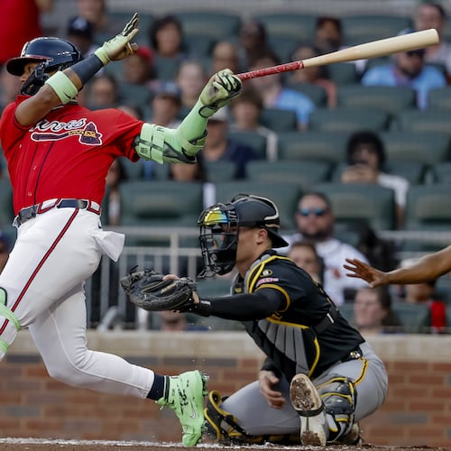 Atlanta Braves' Ronald Acuna Jr., left, hits an RBI single as Pittsburgh Pirates catcher Henry Davis, right looks on during the second inning of a baseball game, Friday, June 5, 2026, in Atlanta. (AP Photo/Erik S. Lesser)