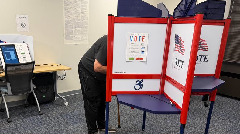 A voter casts a ballot in Henrico County, Va., on the first day of in-person early voting Friday, Sept. 18, 2026. (AP Photo/Sarah Rankin)