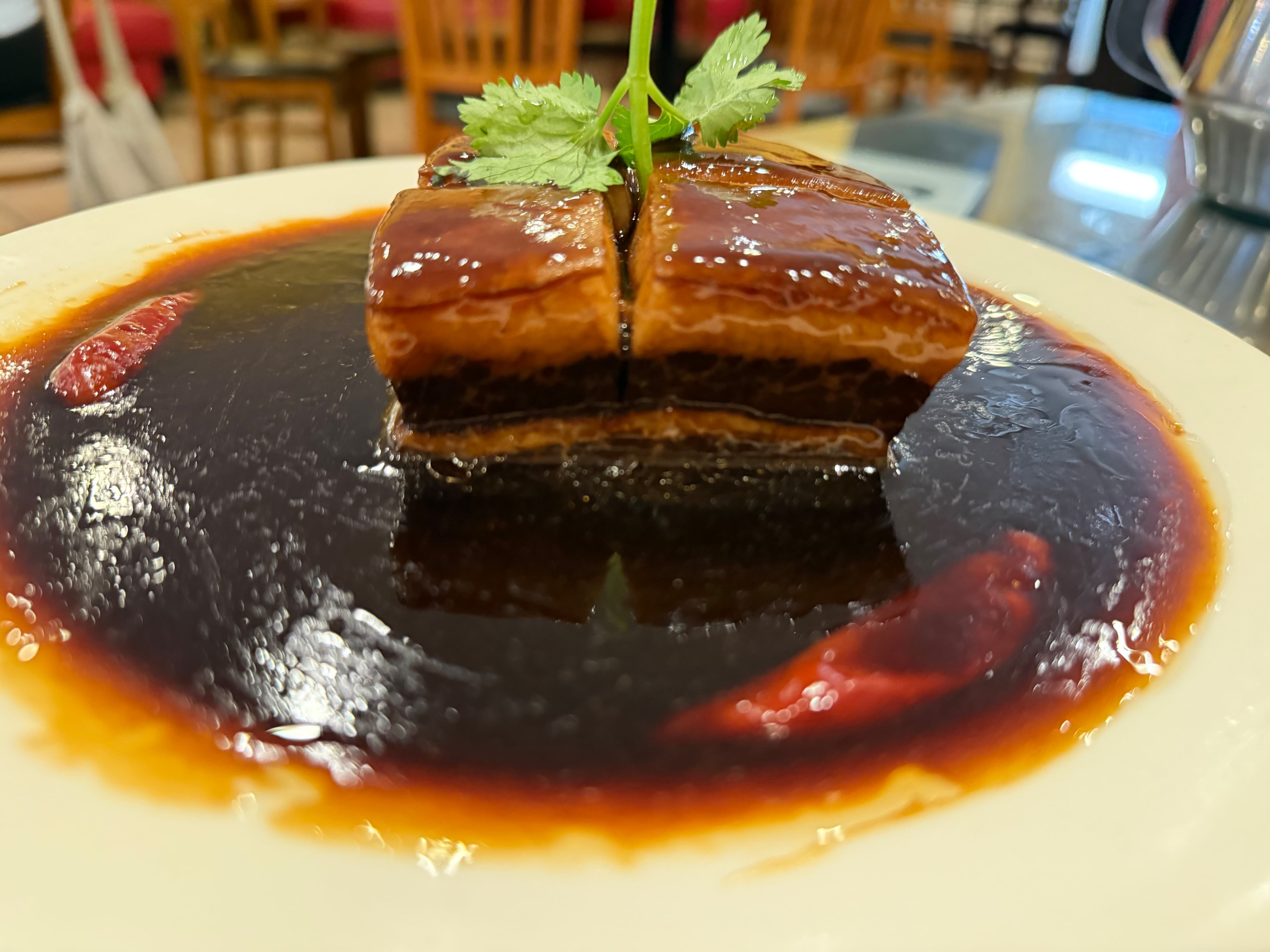 the Dong Po pork belly at Duluth’s Masterpiece is worth the journey up I-85. (Angela Hansberger for the AJC)