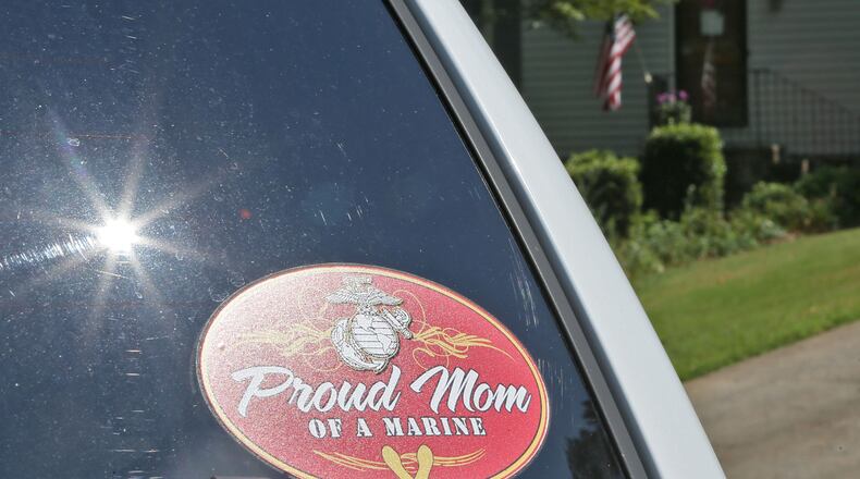 The vehicle parked in front of the Wells residence had stickers saying "Proud Mom of a Marine" and "My son is a U.S. Marine" and a U.S. flag hung from a pole on the front porch. Sprayberry High graduate and ROTC student Skip Wells was was one of the Marines killed in the Chattanooga shooting yesterday. A steady stream of visitors stopped by his mother's house this morning.