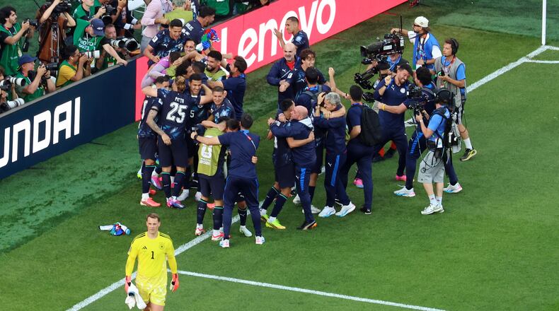 Germany goalkeeper Manuel Neuer (1) reacts as Paraguay players celebrate after a penalty shootout at the end of the World Cup round of 32 soccer match between Germany and Paraguay in Foxborough, Mass., near Boston, Monday, June 29, 2026. (AP Photo/Mark Stockwell)