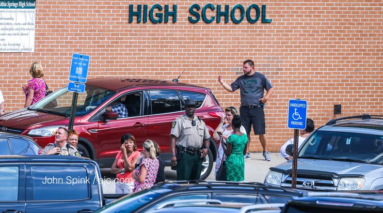 Lithia Springs High School students were sent to the gym Thursday morning to wait for parents to arrive or their bus. (Photo: John Spink/jspink@ajc.com)