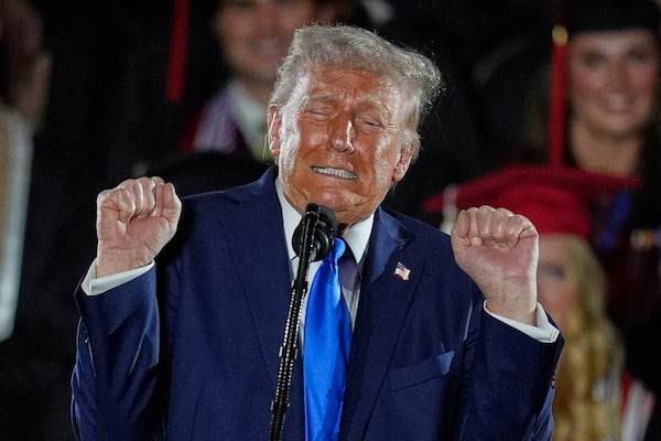 President Donald Trump talks about transgender weightlifters as gives a commencement address at the University of Alabama, Thursday, May 1, 2025, in Tuscaloosa, Ala. (AP Photo/Mike Stewart)