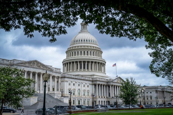 The Capitol is seen under dark skies in Washington, Tuesday, July 15, 2025. (AP Photo/J. Scott Applewhite)