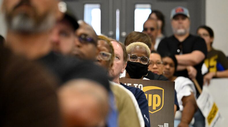 A rally participant holds a sign to show her support during a rally just days before high-stakes contract talks with UPS are set to resume, at Teamsters Local 728, Saturday, July 22, 2023, in Atlanta. The head of the International Brotherhood of Teamsters revved up the union’s membership in Atlanta on Saturday at a rally just days before high-stakes contract talks with UPS are set to resume. (Hyosub Shin / Hyosub.Shin@ajc.com)