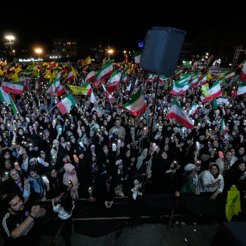 Demonstrators wave Iranian flags and flags of Lebanon's militant Hezbollah group during a pro-government gathering at Islamic Revolution Square in Tehran, Iran, Saturday, May 30, 2026. (AP Photo/Vahid Salemi)