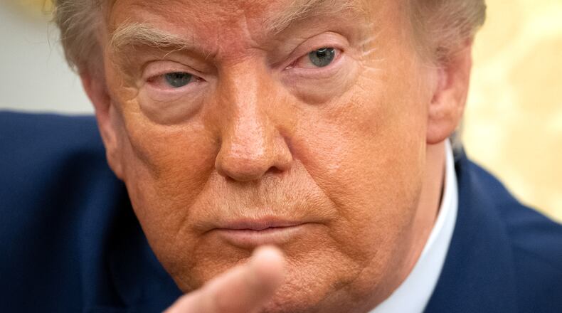President Donald Trump gestures while meeting with Lebanese President Joseph Aoun in the Oval Office at the White House, Tuesday, July 21, 2026, in Washington. (AP Photo/Mark Schiefelbein)
