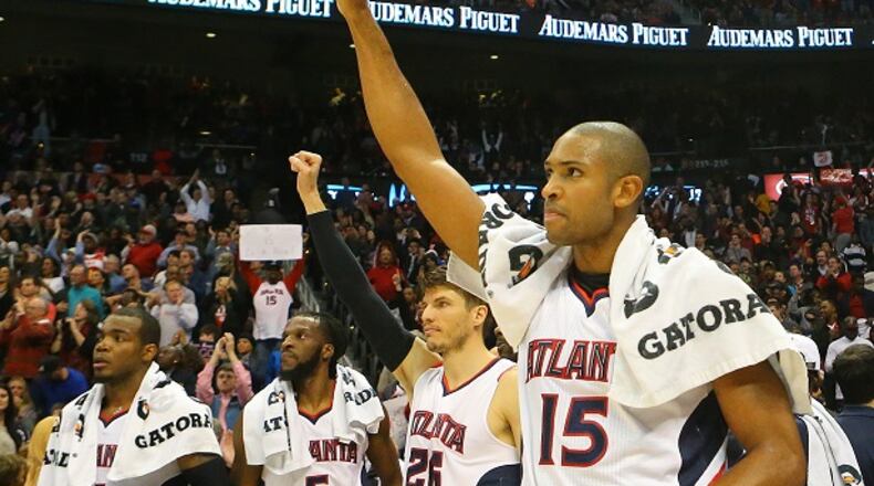 From left to right, Atlanta Hawks Paul Millsap, DeMarre Carroll, Kyle Korver and Al Horford celebrate after setting a franchise record by defeating the Oklahoma Thunder 103-93 in an NBA basketball game on Friday, Jan. 23, 2015, in Atlanta. (AP Photo/Atlanta Journal-Constitution, Curtis Compton) MARIETTA DAILY OUT; GWINNETT DAILY POST OUT; LOCAL TELEVISION OUT; WXIA-TV OUT; WGCL-TV OUT They just don't lose. (Curtis Compton/AJC photo)