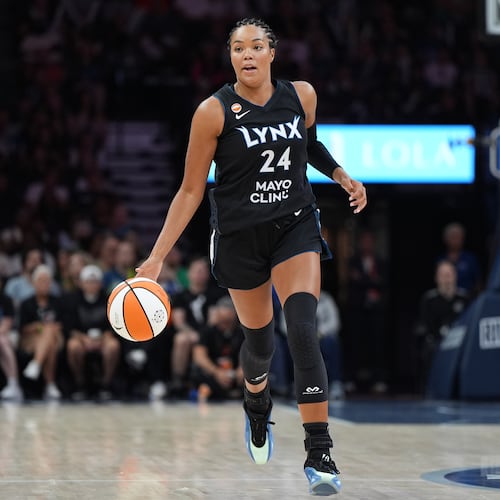 Minnesota Lynx forward Napheesa Collier dribbles down the court during the first half of a WNBA basketball game against the Las Vegas Aces in Minneapolis, Saturday, Aug. 8, 2026. (AP Photo/Abbie Parr)