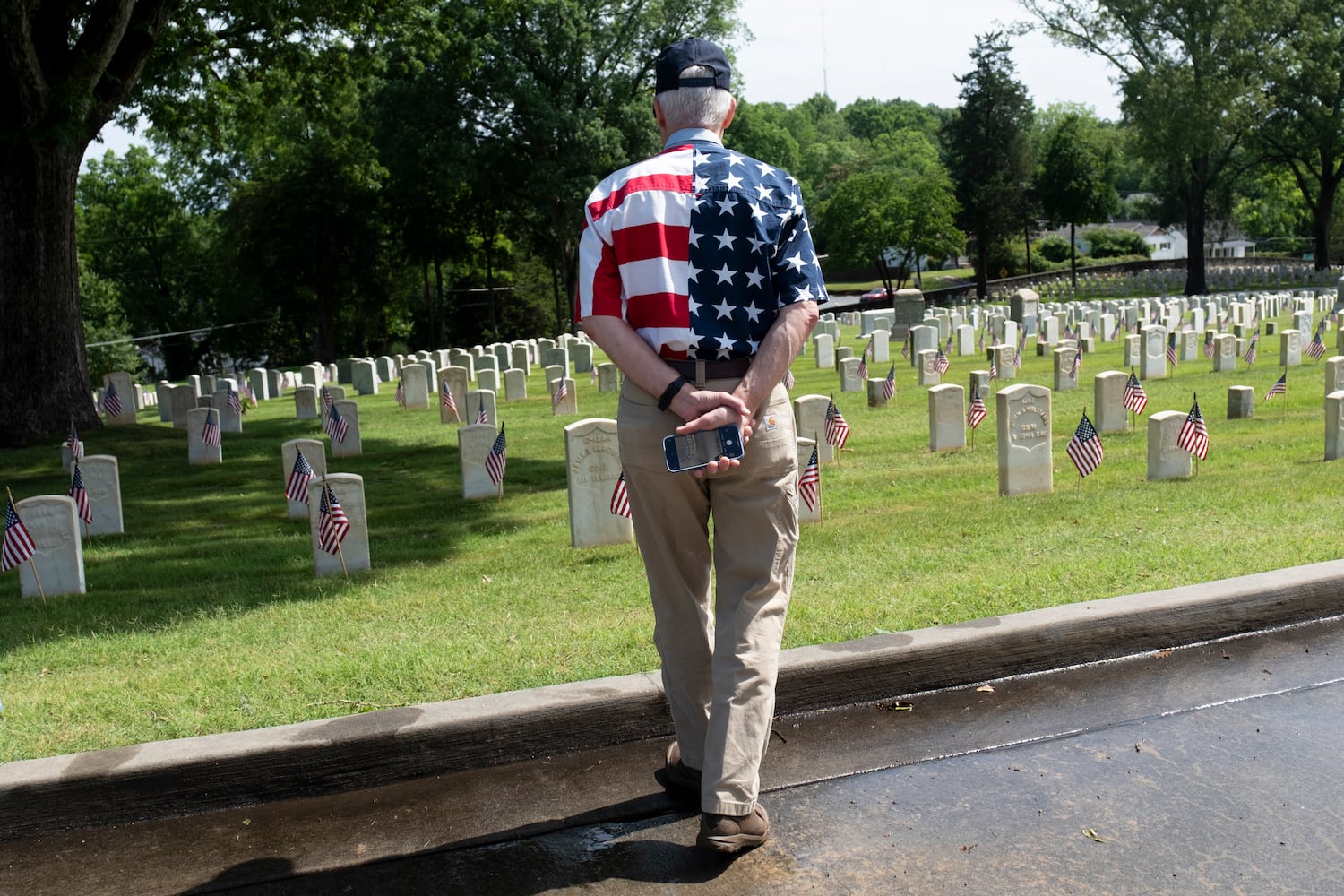 Peter Marx, who is retired from the Army, takes in the graves at Marietta National Cemetery before the Memorial Day ceremony on Monday, May 27, 2024. (Ben Gray / Ben@BenGray.com)