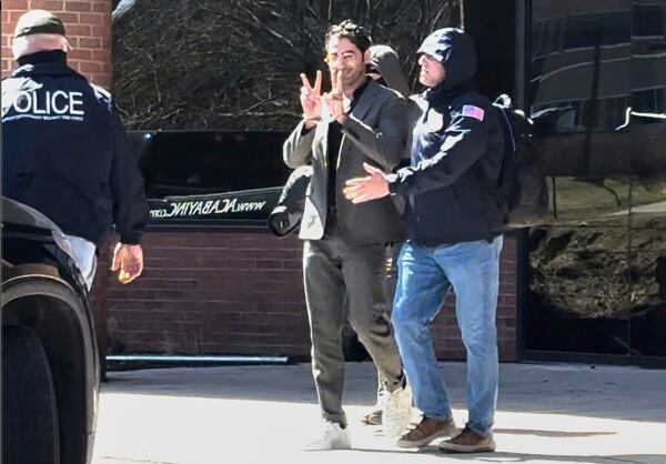 This image taken from a video provided by Christopher Helali shows Mohsen Mahdawi, a Palestinian man who led protests against the war in Gaza as a student at Columbia University, being detained at the U.S. Citizenship and Immigration Services office in Colchester, Vt., on Monday, April 14, 2025. (Christopher Helali via AP)