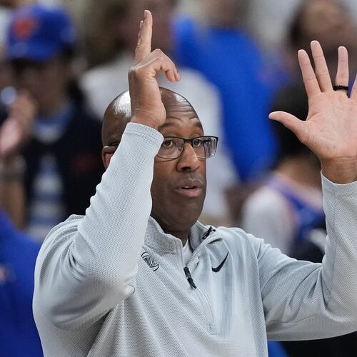 New York Knicks head coach Mike Brown makes a call during the first half of Game 2 of the NBA Finals basketball series against the San Antonio Spurs, Friday, June 5, 2026, in San Antonio. (AP Photo/Eric Gay)
