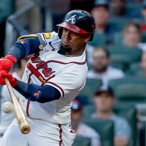 Atlanta Braves' Ozzie Albies (1) hits an RBI sacrifice fly against the Los Angeles Dodgers during the first inning of a baseball game, Tuesday, Aug. 25, 2026, in Atlanta. (AP Photo/Erik S. Lesser)