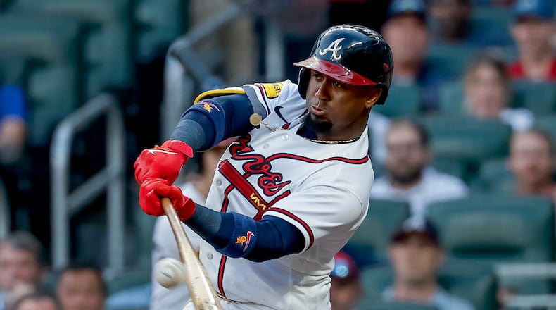 Atlanta Braves' Ozzie Albies (1) hits an RBI sacrifice fly against the Los Angeles Dodgers during the first inning of a baseball game, Tuesday, Aug. 25, 2026, in Atlanta. (AP Photo/Erik S. Lesser)