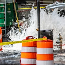 Crews are continuing to work on a broken main on West Peachtree Street at 11th Street in Midtown, with nearby residents warned of impacts to their water service as the crisis reached its fourth day Monday, June 3, 2024. Water had been gushing out of the broken main until Monday morning, when workers were seen pumping out water. (John Spink/AJC)