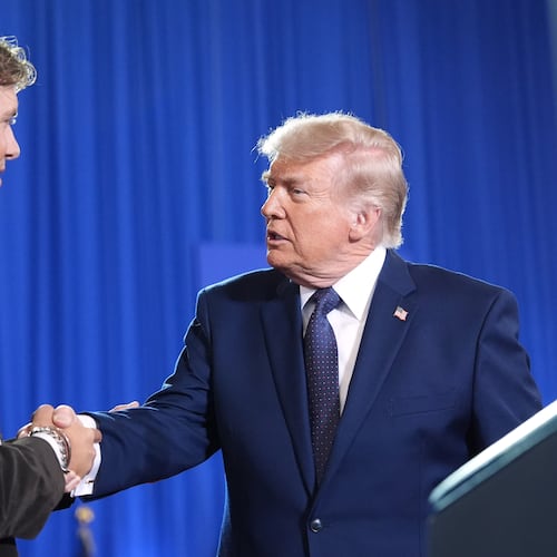 President Donald Trump shakes hands with New York Giants quarterback Jaxson Dart as he arrives to speak at Rockland Community College, Friday, May 22, 2026, in Suffern, N.Y. (AP Photo/Alex Brandon)
