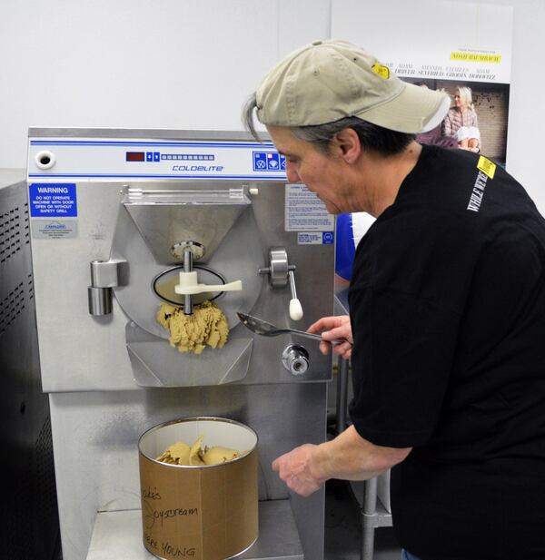 After 10 minutes of churning, it's frozen. Houdeshell removes it from the maker.