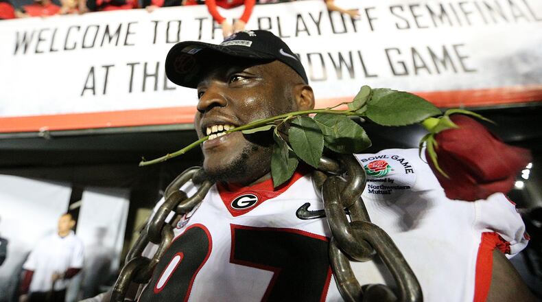 Georgia defender John Atkins celebrates beating Oklahoma 54-48 during double over time in the College Football Playoff Semifinal at the Rose Bowl Game on Monday, January 1, 2018, in Pasadena. Curtis Compton/ccompton@ajc.com