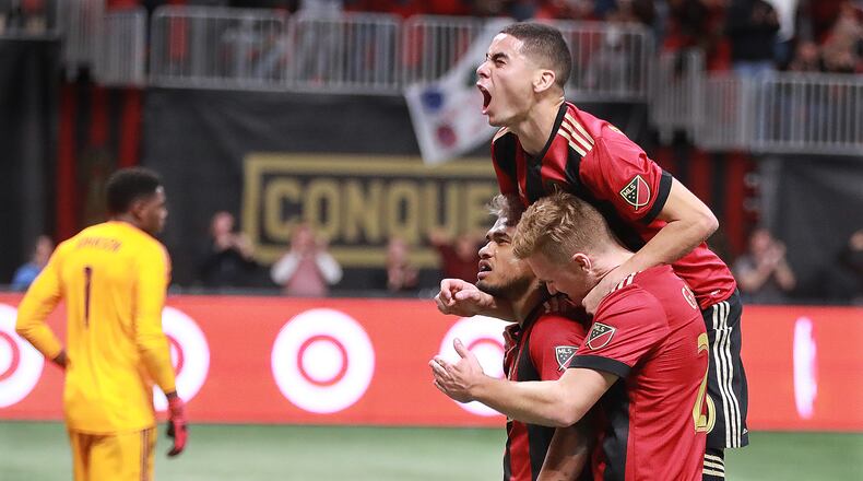 Nov 11, 2018 Atlanta: Atlanta United Josef Martinez celebrates scoring the teamâs first goal on a penalty kick for a 1-0 lead over New York City with teammates Miguel Almiron and Julian Gressel during the first half in their MLS Eastern Conference Semifinal playoff match on Sunday, Nov. 11, 2018, in Atlanta.  Curtis Compton/ccompton@ajc.com