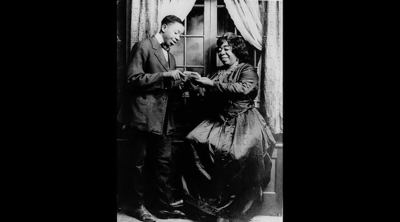 Ma Rainey, right, appears in the touring show "The Rabbit Foot Minstrels" in an undated photo.  She was born Gertrude Pridgett in Columbus, Ga., and became known as the "Mother of the Blues" through her appearances in the South and Midwest. The male actor is not identified. (AP Photo/HO)