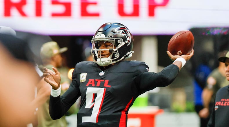Falcons quarterback Michael Penix Jr. attempts a pass during warm-ups before a game against the Panthers at Mercedes-Benz Stadium on Sunday, Nov. 16, 2025, in Atlanta. (Miguel Martinez/AJC)