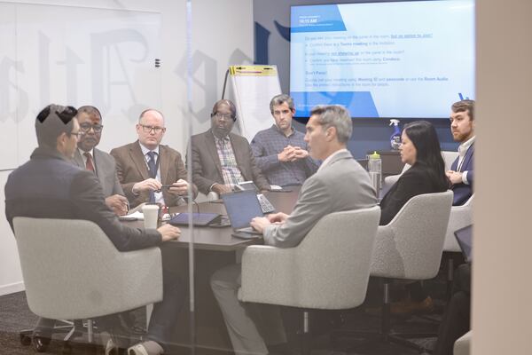 The Atlanta Journal-Constitution editorial board meets with Rivian CEO RJ Scaringe (far left) at AJC offices on Monday, Nov. 17, 2025. (Natrice Miller/AJC)