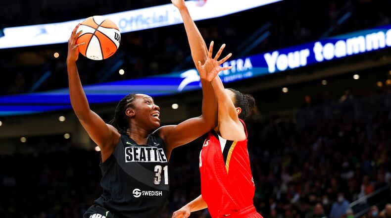 Seattle Storm center Tina Charles (31) goes up to the basket against Las Vegas Aces center Kiah Stokes (41) during the first half of Game 4 of a WNBA basketball playoff semifinal Tuesday, Sept. 6, 2022, in Seattle. (AP Photo/Lindsey Wasson)