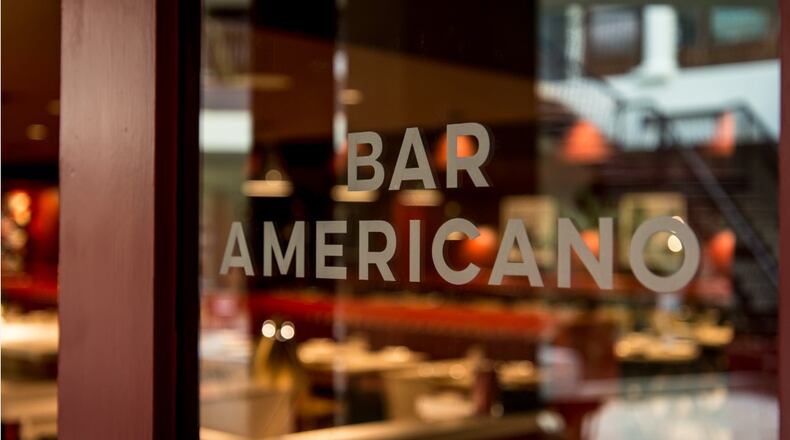 Get $3 drinks plus free meat and cheese snacks during Bar Americano's happy hour. Photo credit: Green Olive Media.