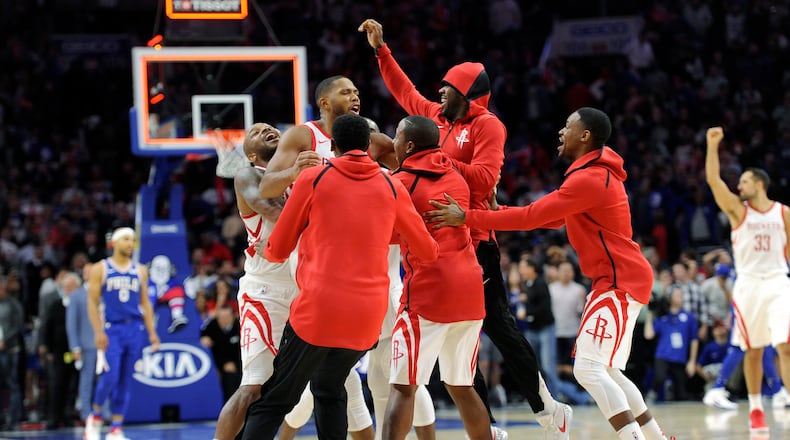 Houston Rockets' Eric Gordon (center) celebrates with his team after defeating the Philadelphia 76ers, 105-104, Wednesday, Oct. 25, 2017, in Philadelphia.