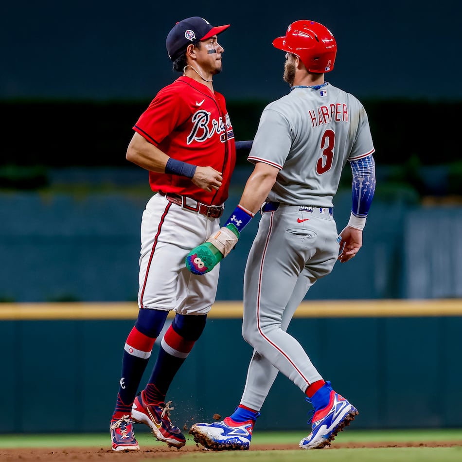 Philadelphia Phillies' Bryce Harper (right) is tagged out by Atlanta Braves shortstop Mauricio Dubón (left) during the ninth inning of a baseball game, Friday, Sept. 11, 2026, in Atlanta. (Erik S. Lesser/AP)